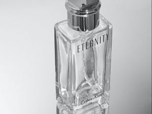 a bottle of perfume sitting on top of a table