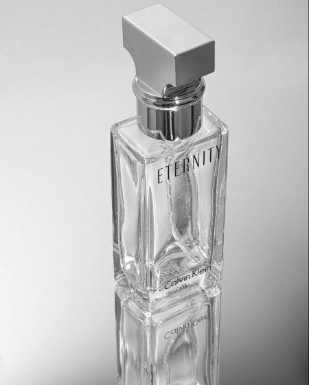 a bottle of perfume sitting on top of a table