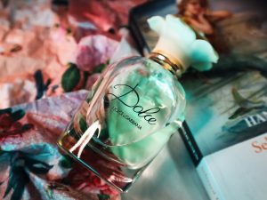 a bottle of perfume sitting on top of a table